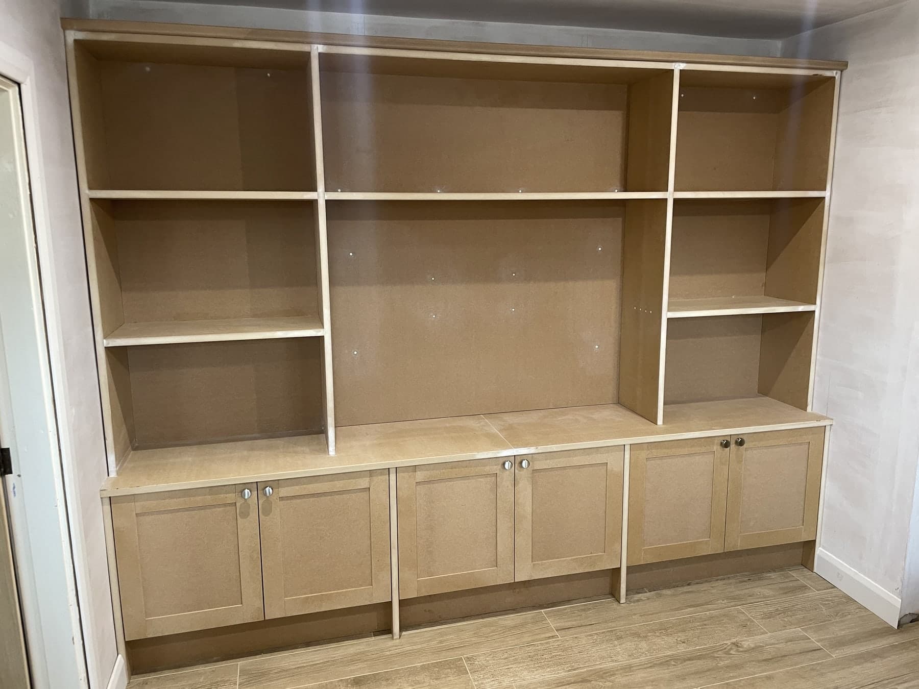 Completed fitted media unit with shelving and storage
