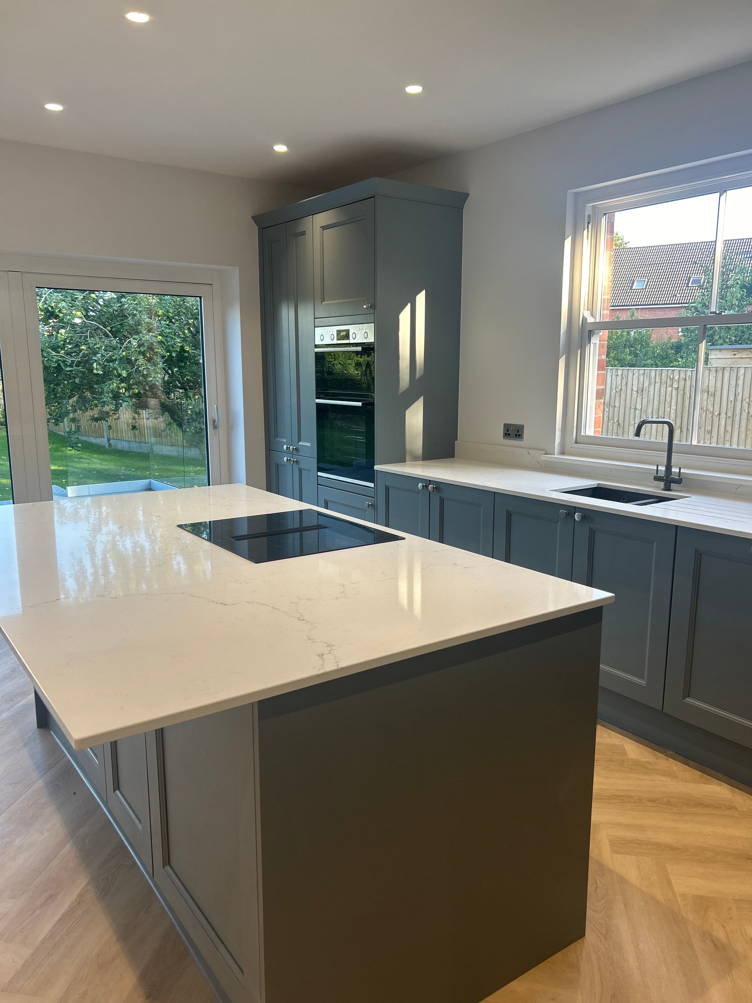 Grey shaker utility cabinet with sink and worktop